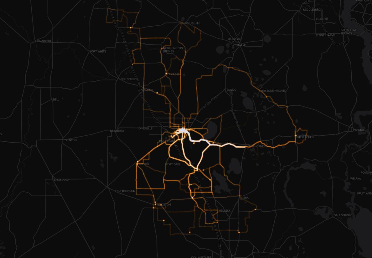 Heatmap of cycling routes drawn over a dark map